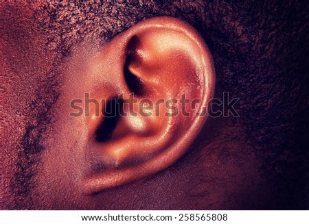 African male ear. Hearing concept.