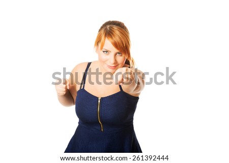 Overweight angry woman with her fists up