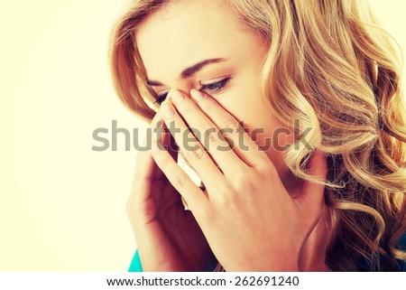Young woman with sinus pressure pain