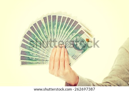 Woman with polish money in hand