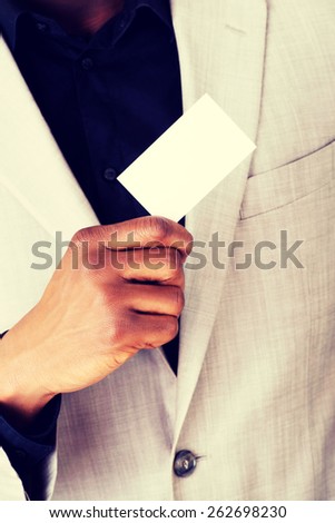 Businessman showing blank business card.