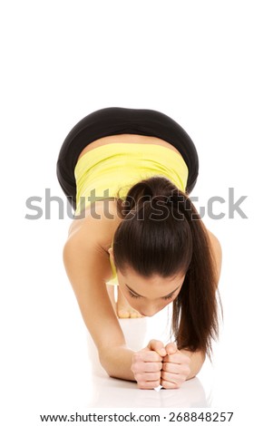 Young fitness woman in warm up exercise.