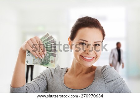 Happy smiling woman with polish money.