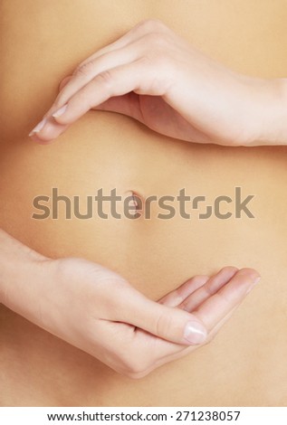 Close up on woman slim belly.
