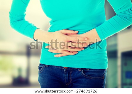 Young woman with stomach issues