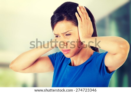 Young woman with huge head ache