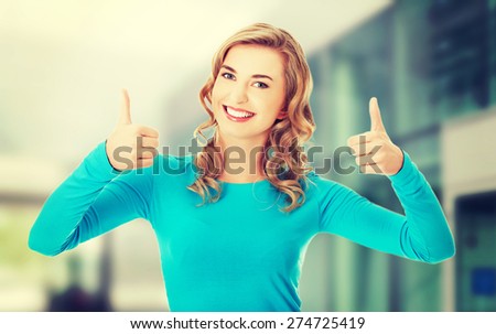 Happy smiling woman with ok hand sign