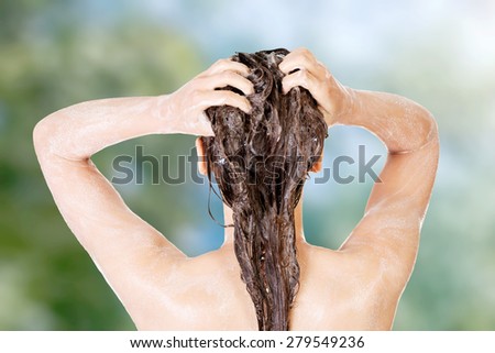 Beautiful caucasian woman taking a shower.