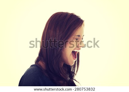 A very frustrated and angry woman screaming.