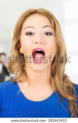 Young shocked woman with open mouth.