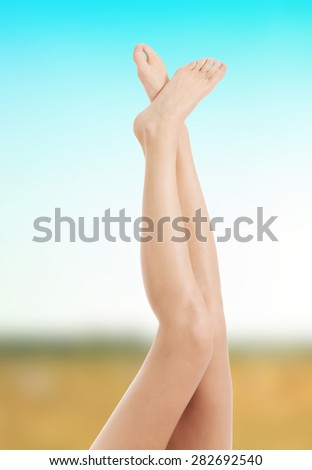Beautiful female crossed legs after depilation.