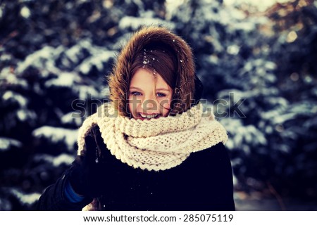 Teenage woman in winter clothes outdoor