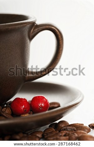 Ripe coffee berries on a plate
