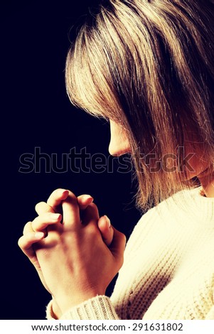 Young caucasian woman praying to Jesus