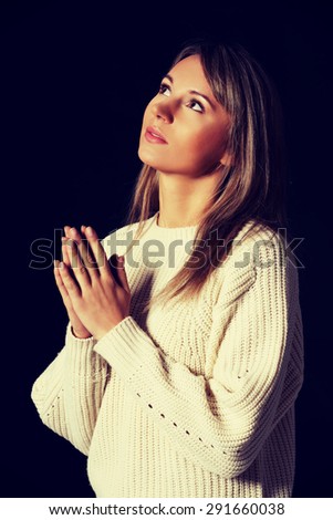 Young caucasian woman praying to Jesus Young caucasian woman praying to Jesus