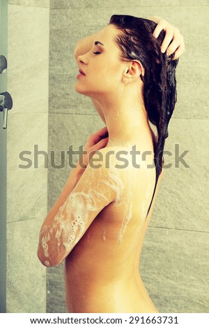 Beautiful  fit woman taking shower