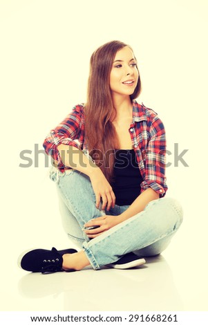 Happy smiling woman sitting cross-legged