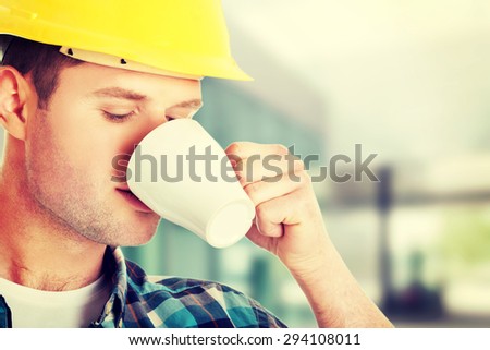 Worker on a break drinking coffee and having a rest