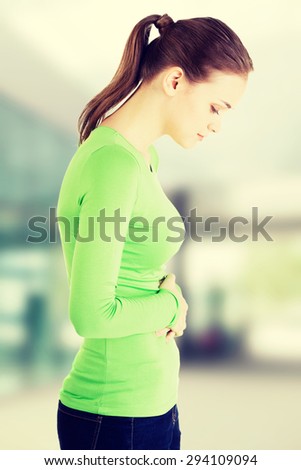 Young woman with stomach issues.