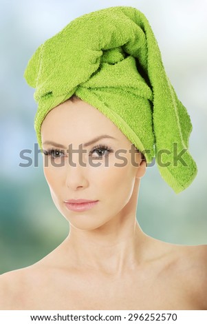 Beautiful woman with towel wrapped on head.