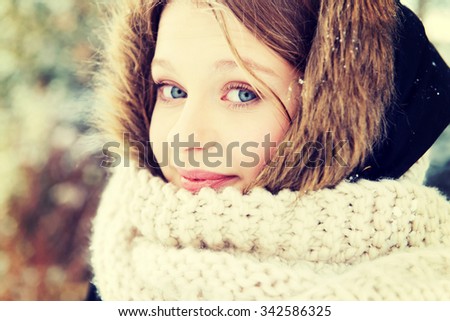 Teenage woman in winter clothes outdoor