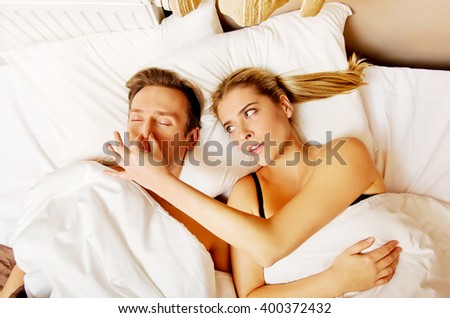 Couple in bed,man snoring woman can\'t sleep