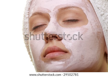 Portrait of a styled model with facial cream mask.
