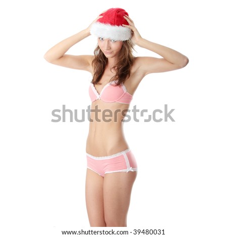 Beautiful,slim, fit and sexy Caucasian woman in pink underwear and santa hat isolated