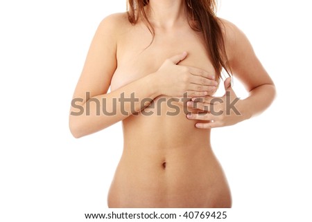 stock photo Young Caucasian adult woman examining her breast for lumps or