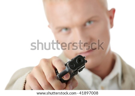 Young caucasian blond man aiming with pistol in hand