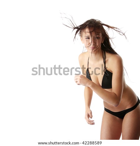 Beautiful wet caucasian woman in black bikini isolated on white background