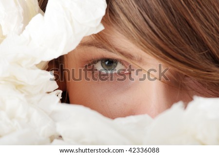 Ill teen girl with lot of tissues around