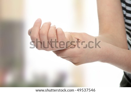 Woman holding her wrist - pain concept