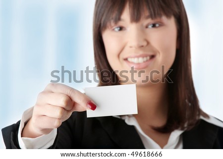 Portrait of a beautiful businesswoman holding a white card.