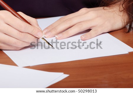 Beautiful girl writing a letter