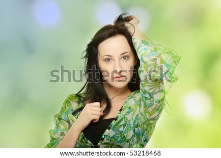 Young beautiful woman with wind (hair blowing)