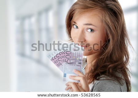 Beautiful young woman holding euros bills - real estate loan concept