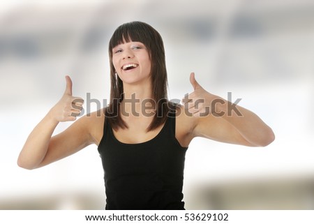 Happy young caucasian woman with thumbs up, isolated on white background