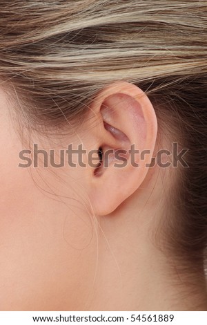 Young caucasian woman ear closeup.