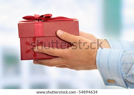 Business man offering a gift