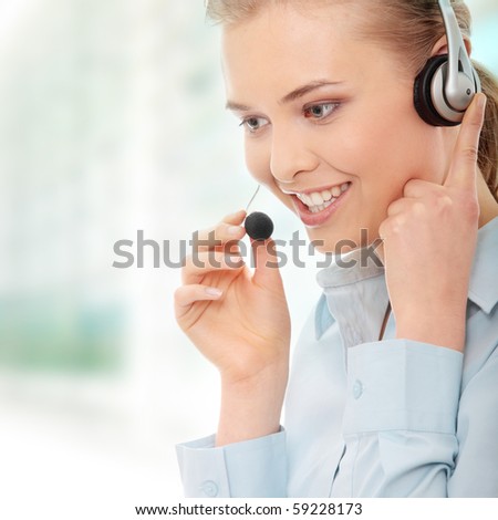Call center woman with headset. Beautiful smiling caucasian woman