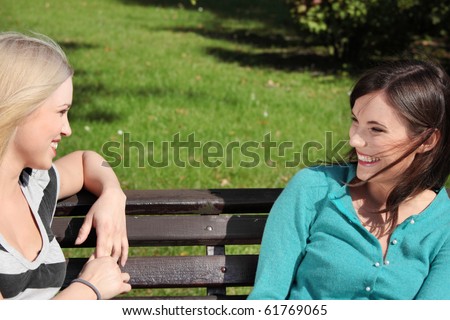Two friended woman at park talking