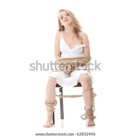 stock photo The beautiful blond girl tied with rope kidnapping concept
