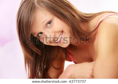 stock photo Teen girl in swimsuit over abstract pink