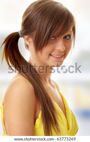 stock photo Beautiful brunette girl in yellow dress