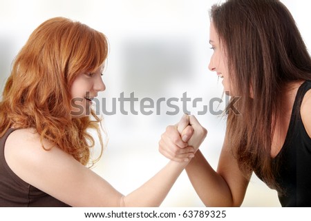 Two womans hands fight