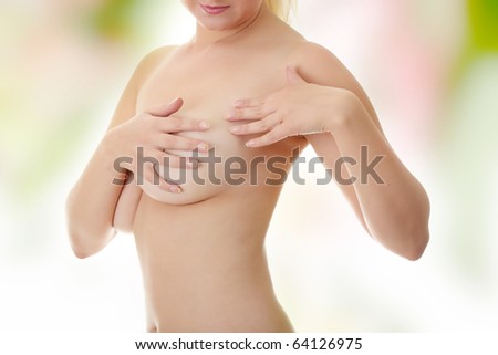 Breast cancer - Woman holding her breast