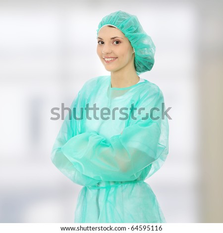 Portrait of female surgeon or nurse wearing protective uniform