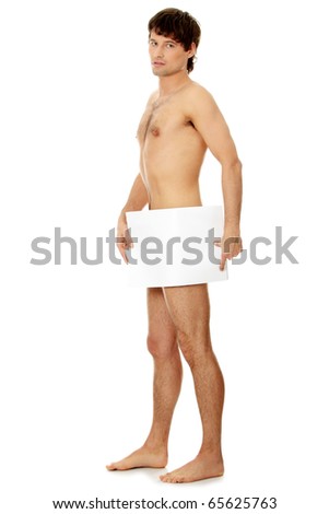 stock photo Young handsome nude man covering his self with a copy space