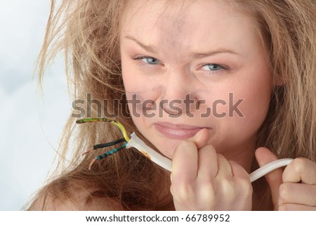 Young woman with wire - electric shock